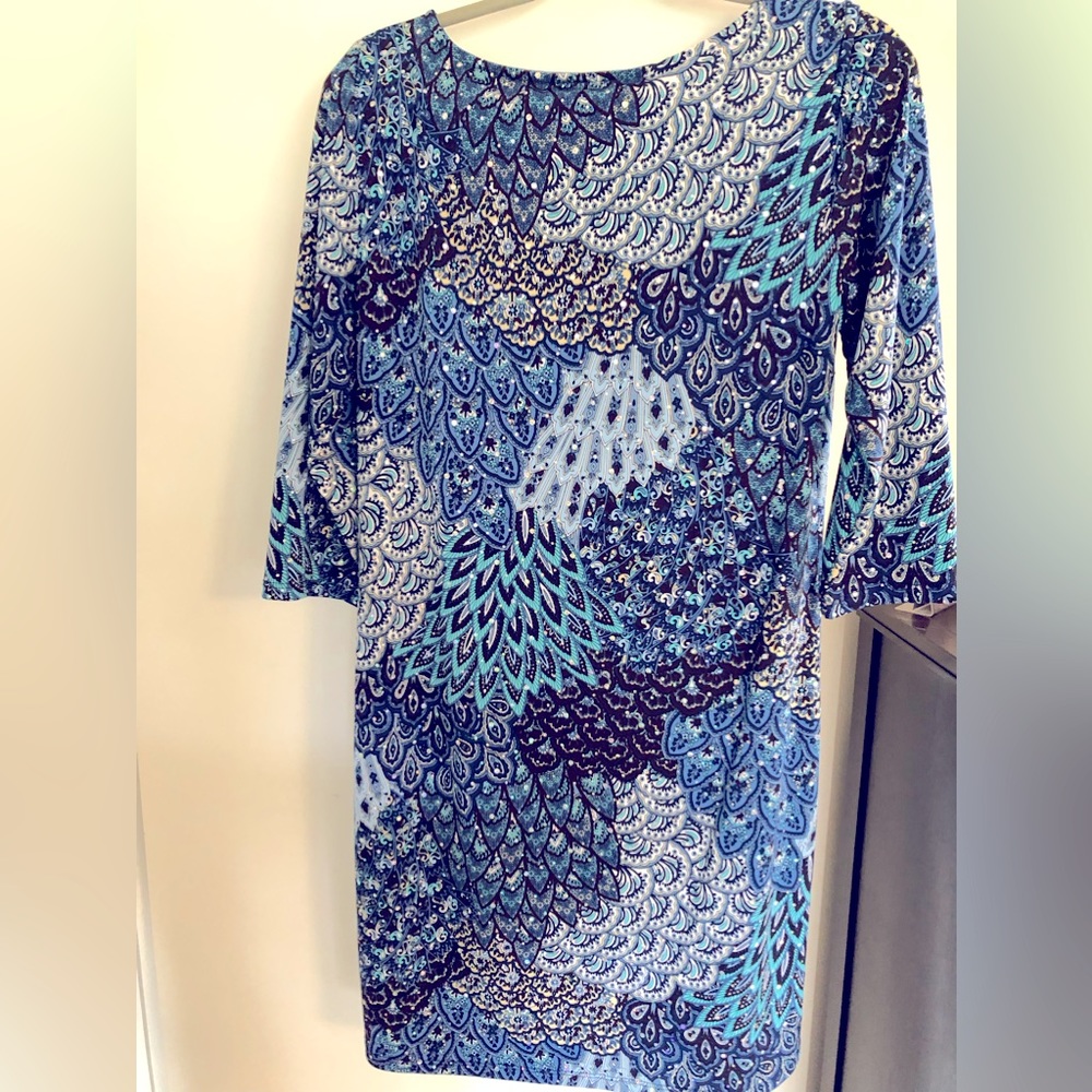 Women’s dress, 3/4 length sleeves. Blue print, rhinestone studs, shell designs.